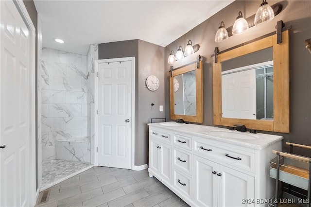 bathroom featuring vanity and tiled shower