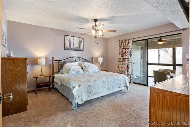 bedroom with ceiling fan, light colored carpet, a textured ceiling, and access to outside