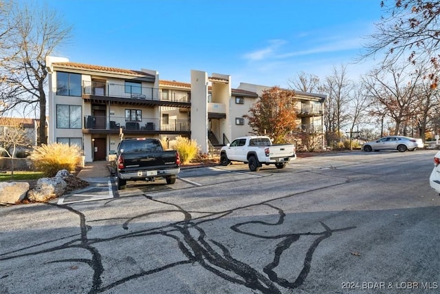 49 Casa Se Ville Dr Unit 3C-164, Lake Ozark, MO 65049 - view of building exterior with uncovered parking