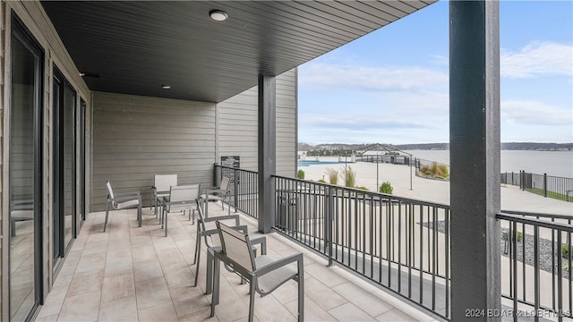 balcony featuring a water view