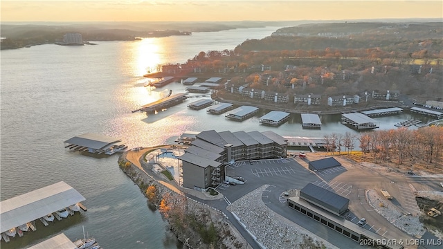 aerial view at dusk with a water view