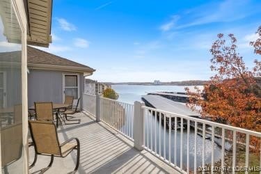 balcony featuring a water view