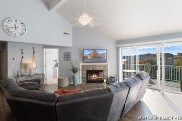 living room featuring beam ceiling, ceiling fan, hardwood / wood-style floors, and high vaulted ceiling