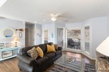 living room featuring hardwood / wood-style flooring and ceiling fan