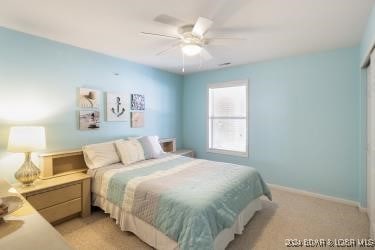 carpeted bedroom featuring ceiling fan