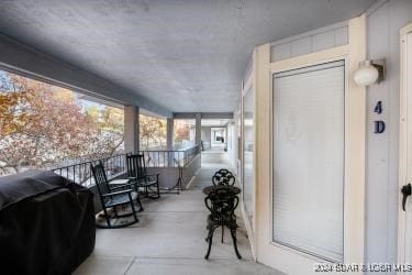 balcony featuring covered porch and area for grilling