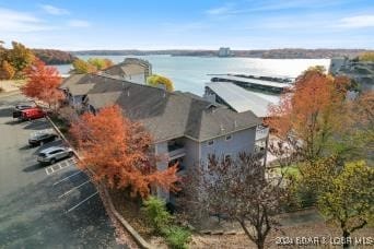 birds eye view of property with a water view