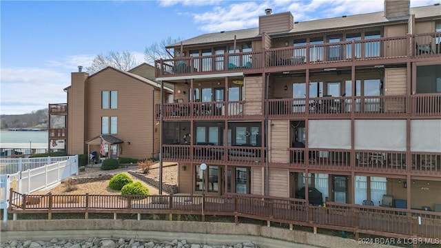 99 Rock Dove Ln Unit 2B, Camdenton, MO 65020 - view of building exterior featuring a fenced backyard