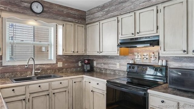 kitchen with decorative backsplash, sink, and black appliances