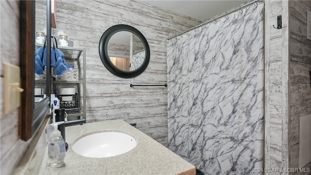 bathroom featuring sink and walk in shower