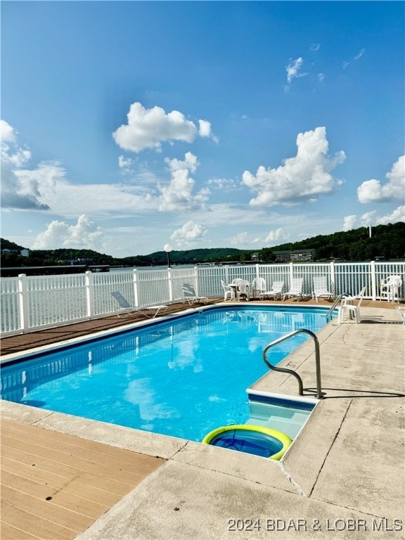 view of pool featuring a patio