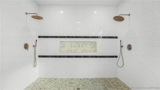 full bath with a tile shower