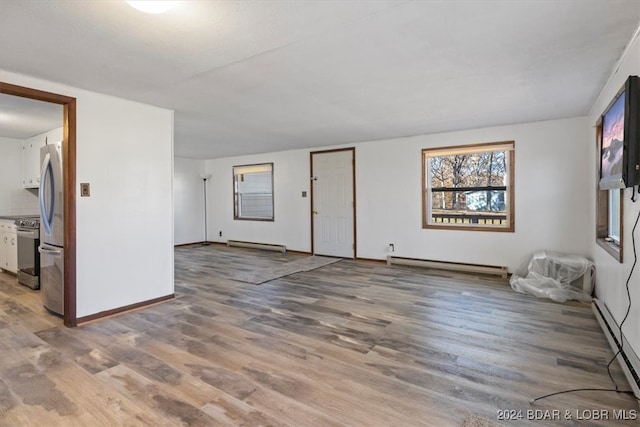 interior space featuring a baseboard radiator and hardwood / wood-style flooring