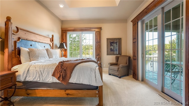 carpeted bedroom featuring access to outside