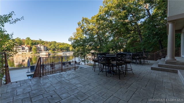 view of patio featuring a water view