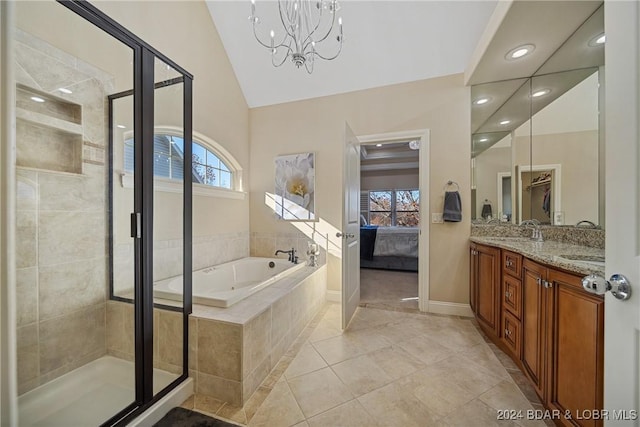 bathroom with vanity, tile patterned floors, vaulted ceiling, separate shower and tub, and a notable chandelier