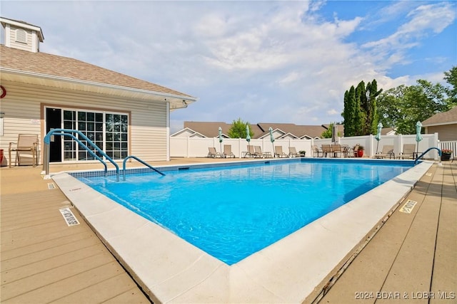 view of pool featuring a patio