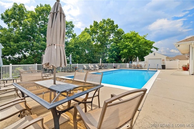 view of swimming pool featuring a patio area