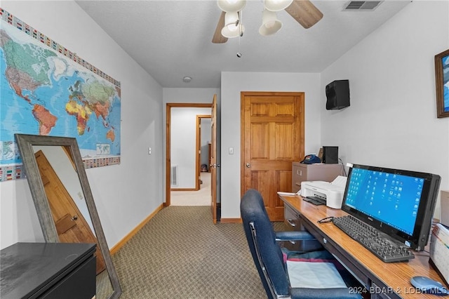 office with light carpet and ceiling fan