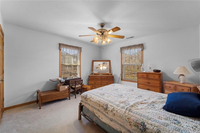 bedroom featuring ceiling fan and light colored carpet