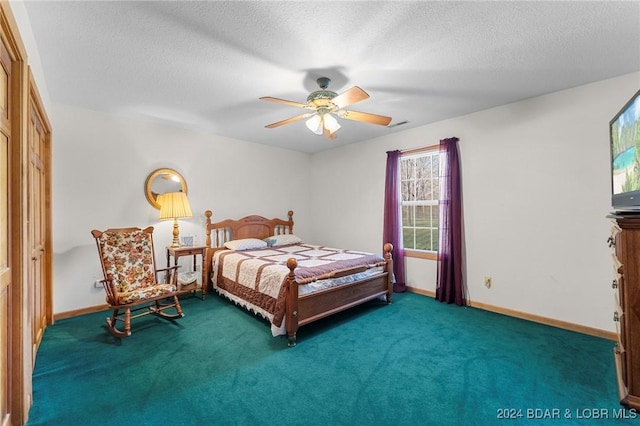 carpeted bedroom with ceiling fan, a closet, and a textured ceiling