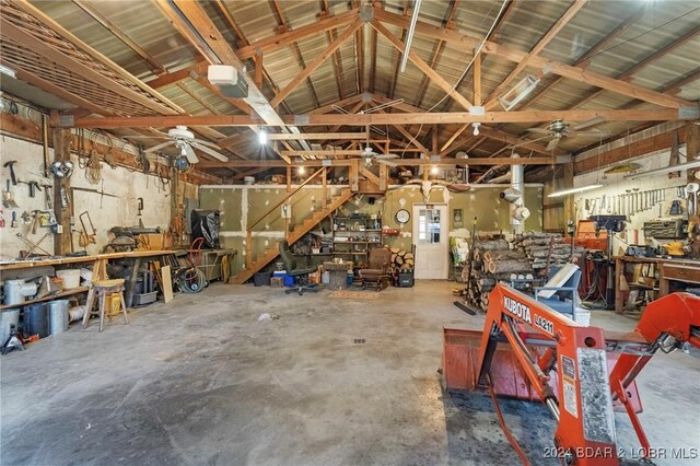 garage featuring a workshop area and ceiling fan