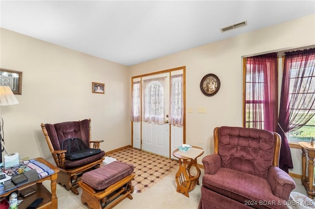 sitting room with light colored carpet