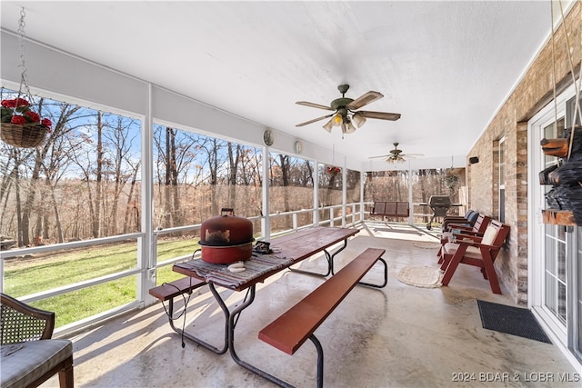 sunroom / solarium with ceiling fan