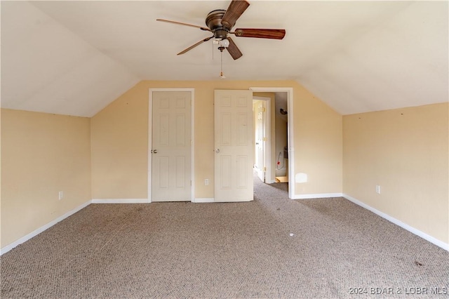 additional living space with carpet flooring, ceiling fan, and lofted ceiling