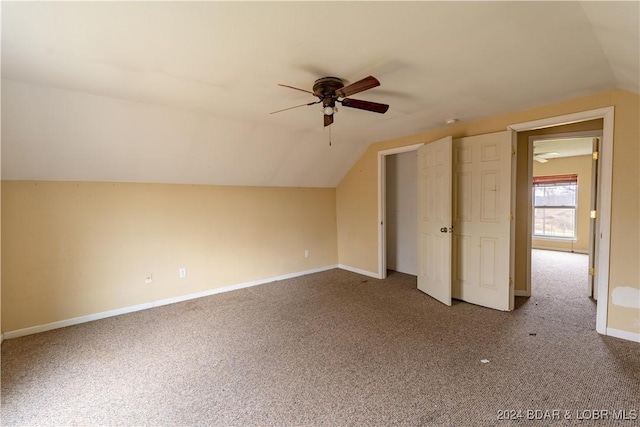 bonus room with ceiling fan, lofted ceiling, and carpet floors