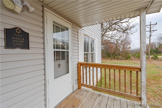 wooden deck with a yard