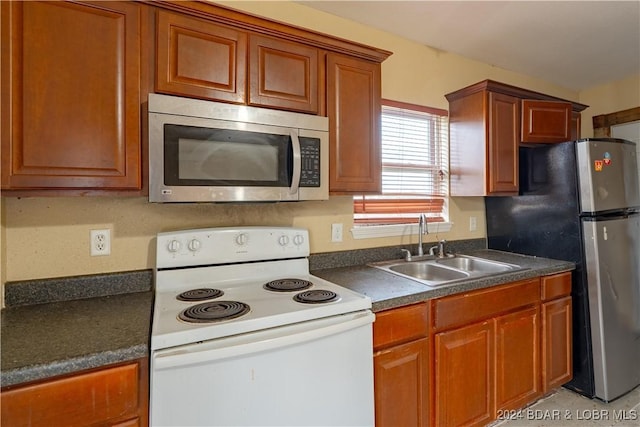 kitchen with appliances with stainless steel finishes and sink