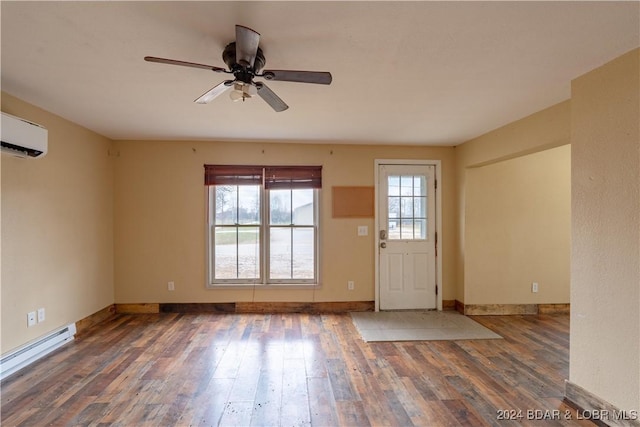 interior space with dark hardwood / wood-style floors, a wall unit AC, ceiling fan, and a baseboard heating unit