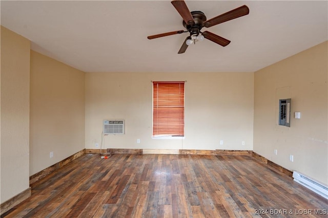 spare room with dark hardwood / wood-style floors, ceiling fan, electric panel, and a baseboard radiator