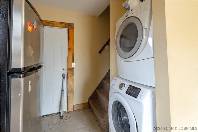 laundry area featuring stacked washer and dryer