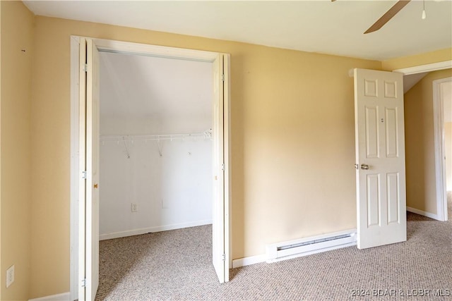 unfurnished bedroom with ceiling fan, a closet, light colored carpet, and a baseboard radiator