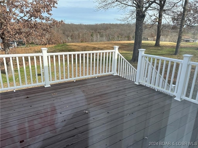 wooden deck with a yard