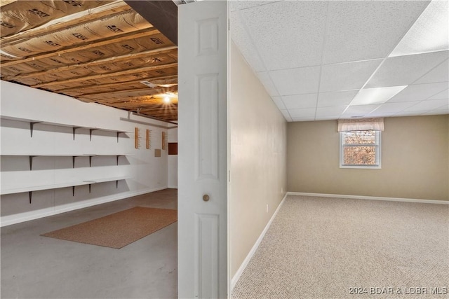 basement featuring a drop ceiling