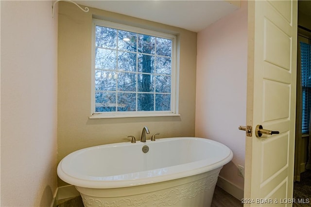 full bath with a soaking tub