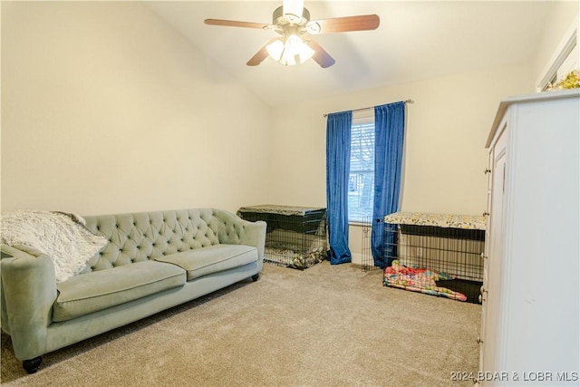 carpeted living area with a ceiling fan and lofted ceiling