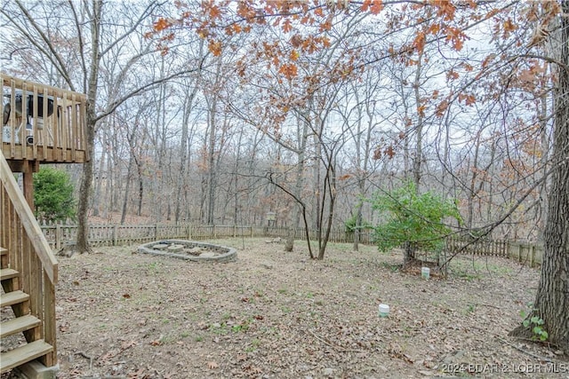 view of yard with a wooden deck