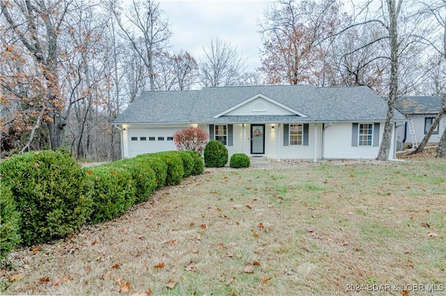 ranch-style house with a front yard and a garage