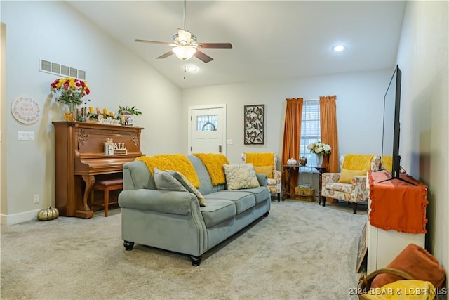 carpeted living room featuring vaulted ceiling and ceiling fan