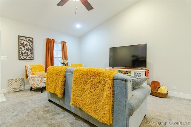 living room featuring carpet floors, ceiling fan, and lofted ceiling