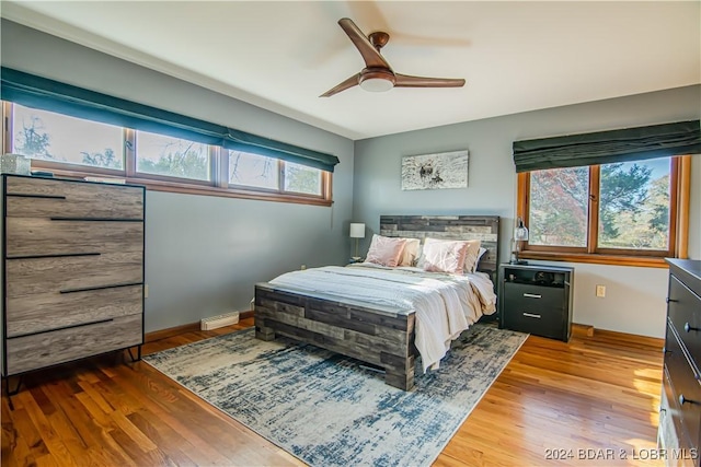 bedroom featuring hardwood / wood-style floors and ceiling fan