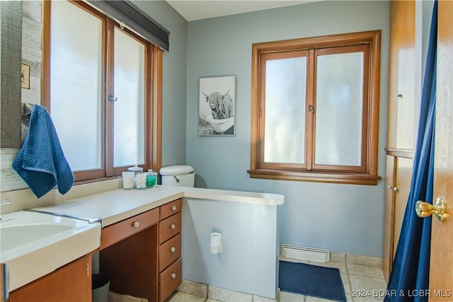 bathroom featuring vanity, tile patterned flooring, and toilet