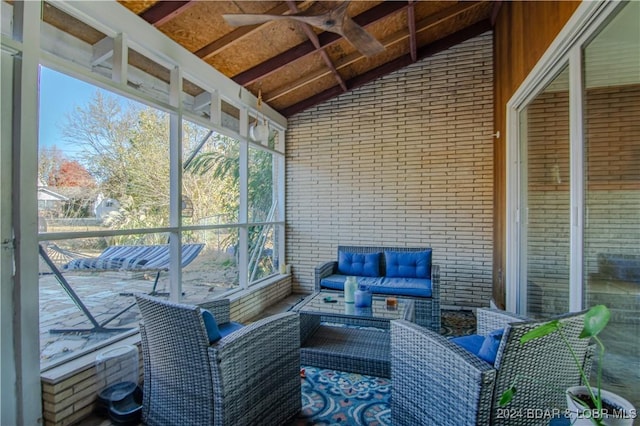 sunroom with vaulted ceiling with beams