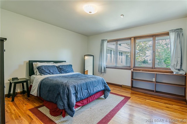 bedroom with light wood-type flooring