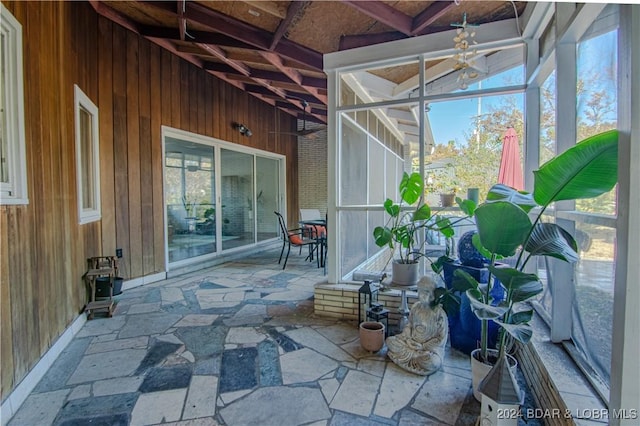 sunroom with beamed ceiling