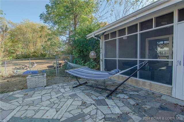 view of patio / terrace with a sunroom